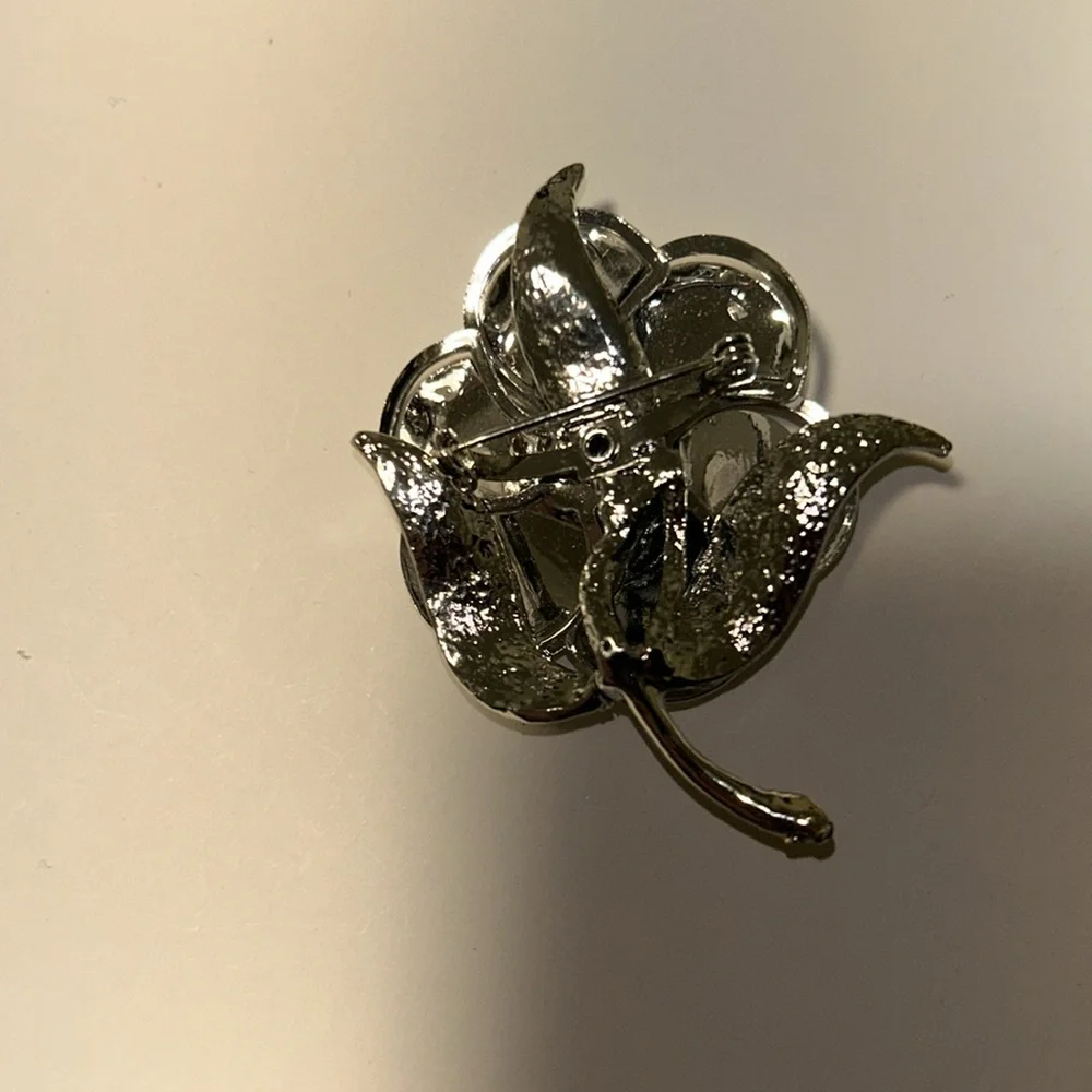 Silver Matte and Glossy Flower Brooch with a Aurora borealis Crystal